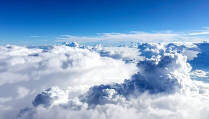 Fototapeta premium Majestic white clouds drift serenely across a brilliant blue sky, offering a sense of peace and boundless possibility for your next project