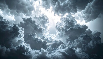 Dramatic, epic storm clouds fill the sky with intense light breaking through, creating a powerful, awe inspiring atmosphere for your next project.
