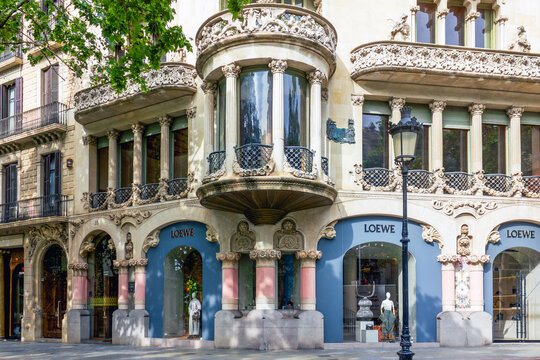 Barcelona, Spain - June 13, 2025: Casa Lleo Morera facade with ornate columns and Loewe boutique in Barcelona, Spain. 