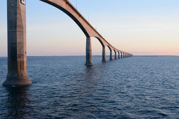 View of the Confederation Bridge extending across the Northumberland Strait between Prince Edward Island and New Brunswick, Canada. Captured at sunset.