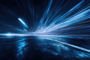 Abstract image showing blurred, blue light streaks converging toward a horizon, suggestive of speed