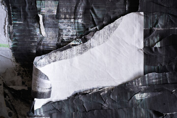 A piece of peeled white flag shape paper on glitchy black photo copy paper
