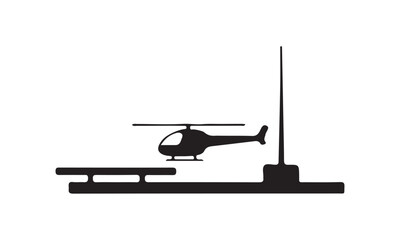 Fototapeta premium Silhouette of a helicopter on a helipad with antenna