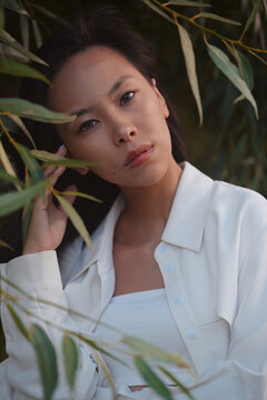 Portrait of young asian woman in leaves
