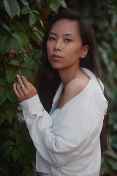 Portrait of young asian woman in leaves