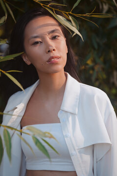Portrait of young asian woman in leaves