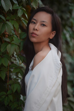 Portrait of young asian woman in leaves