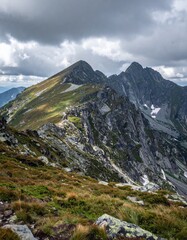 Rocky mountain ridge under cloudy sky showing dramatic natural wilderness