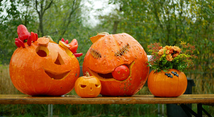 Halloween smiling carved pumpkin candles carved scary harvest jack o lantern autumn fall flaring...