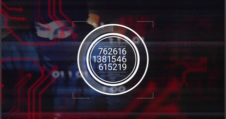 Typing masked hooded hacker entering numeric codes on laptop in office, with red HUD graphics