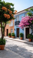 Charming street lined with colorful buildings and blooming flowers in pots.