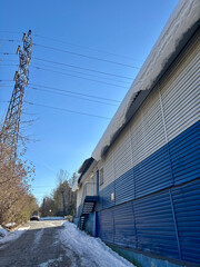 Snow is hanging from the roof