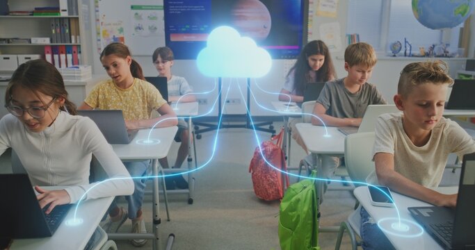 Kids Connected Cloud in Digital Classroom. Diverse Pupils Work on Laptops Connected to Cloud by Glowing Digital Lines. Cloud Technology, Networked Learning, Technology Education of Future. Dolly Shot. - Powered by Adobe