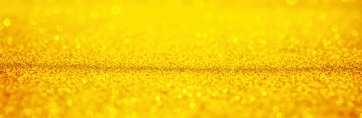 Abstract gold glitter sparkle texture with bokeh background