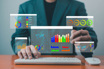 Businessman analyzing digital data dashboard, concept of big data analytics, business intelligence, marketing performance, finance report, and data visualization technology.