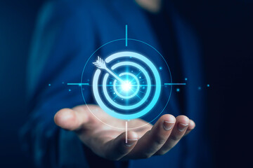 Businessman holding digital target with arrow, concept of business goal, success strategy, marketing objective, leadership vision, and digital achievement business goals, strategy, success, focus,