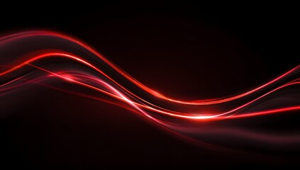 Fototapeta premium Abstract glowing red waves of light flowing across a dark background representing energy and motion