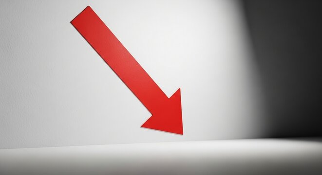 A vibrant red arrow pointing diagonally downwards against a minimalist white and grey background, symbolizing decline or a negative trend.