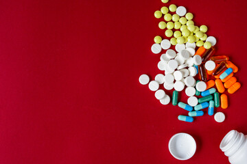 colored tablets in plastic container top view
