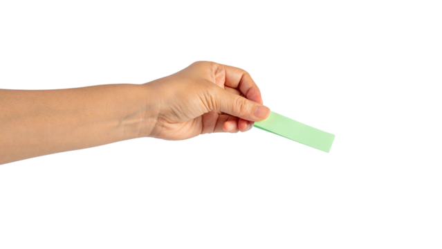 Paper stickers in hand. Hand holding a green sticker. Notes for the message on transparent background.