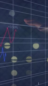 Interacting with animation of rising financial graph and data visualization in hand