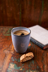 Cup of coffee on rustic wooden background. Soft focus. Copy space	