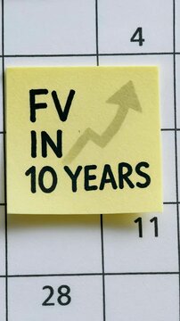 FV in 10 years time value money future planning optimistic upward trend sticky note calendar handwriting finance future value planning