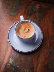 Cup of coffee on rustic wooden background. Soft focus. Copy space	