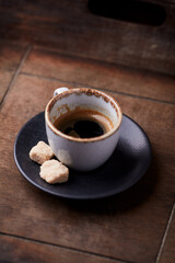 Cup of coffee on rustic wooden background. Soft focus. Copy space	