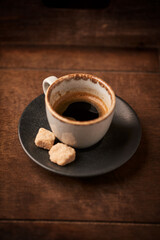 Cup of coffee on rustic wooden background. Soft focus. Copy space	