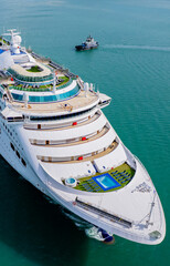 Cruise ships sailing the sea take tourists on a journey and relax on holidays.