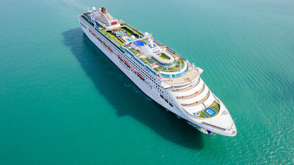 Cruise ships sailing the sea take tourists on a journey and relax on holidays.