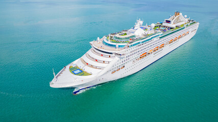 Cruise ships sailing the sea take tourists on a journey and relax on holidays.