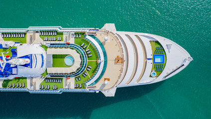 Cruise ships sailing the sea take tourists on a journey and relax on holidays.