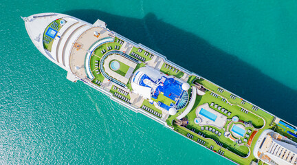 Cruise ships sailing the sea take tourists on a journey and relax on holidays.