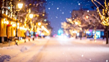 Beautiful blurred street of festive night or evening city with snowfall and Christmas lights. Abstract christmas defocused background.