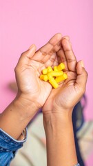 Hands holding yellow earplugs (1)