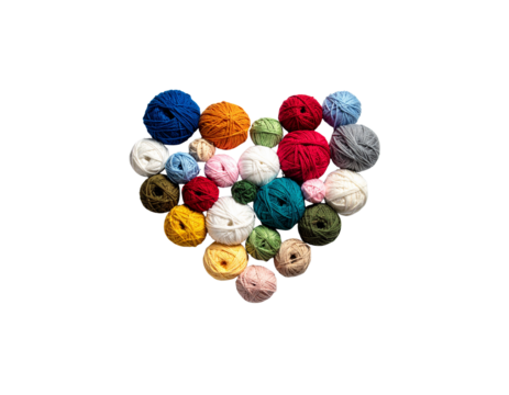 A pile of colorful fashion buttons mixed with blue, green, yellow and red beads on a white background.
