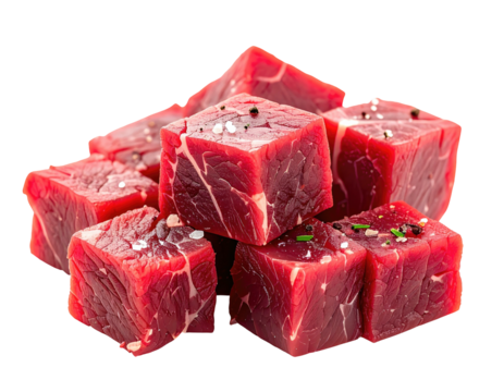 Cubed, raw, red meat portions, seasoned with salt and pepper, arranged in a random pile