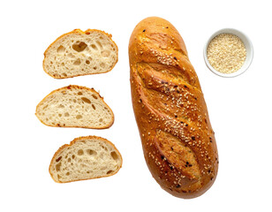Crusty loaf of bread and slices with sesame seeds, with a small bowl of seeds nearby