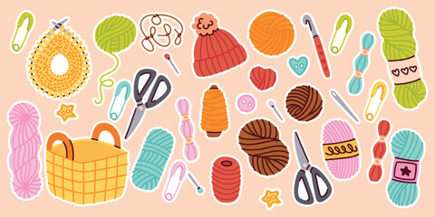 Yarn skeins, crochet hooks, scissors and sewing accessories arranged in bright composition for craft design themes.