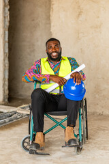 Fototapeta premium Smiling African construction engineer in a wheelchair holds a blueprint and hard hat, radiating confidence on a building site