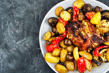 Appetizing baked pork with vegetables.