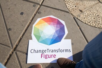 Overhead view of a card showing change transforms figure on pavement