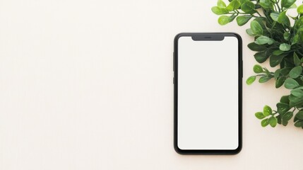 Smartphone on a neutral surface with greenery adding a touch of nature during daytime