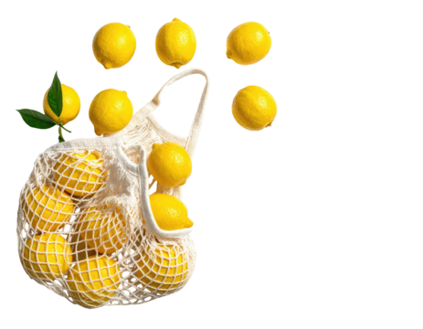 Bright yellow lemons spilling from a white net bag against a black background