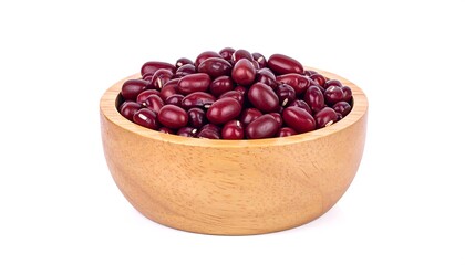 Fototapeta premium Pile of shiny, dark red kidney beans in a light wooden bowl