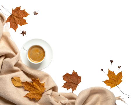 Coffee cup on saucer surrounded by a folded beige blanket and autumn leaves on black backdrop