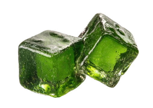 Two vibrant green, translucent gelatin cubes angled close