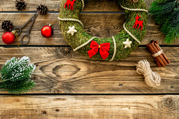 Christmas wreath with accessories, top view. New Year DIY decoration